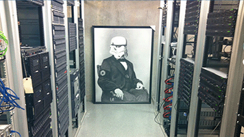 a large old-timey portrait of a Stormtrooper leaning against a wall in a server room